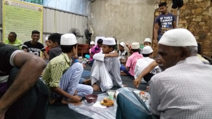 Breaking iftar during Ramadan in the local Digana community where their mosque was burnt down. This was a temporary structure until the new mosque is built.